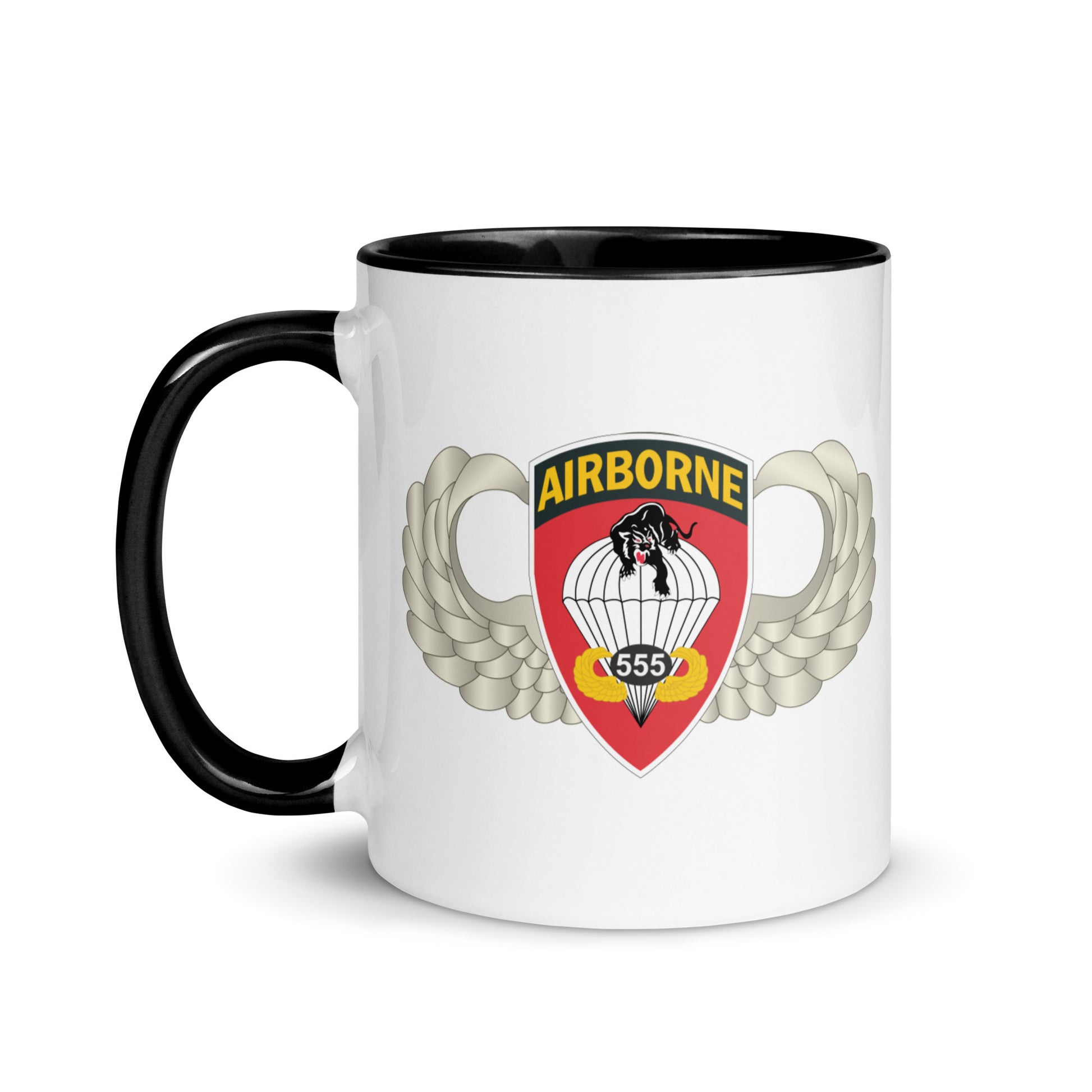 "Ceramic mug with black interior featuring 555th Parachute Infantry Battalion SSI, front view"