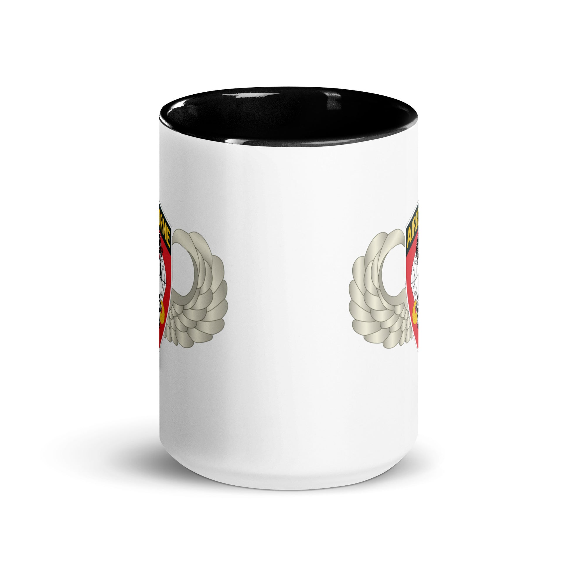  "Ceramic mug with black interior featuring 555th Parachute Infantry Battalion SSI, center view"