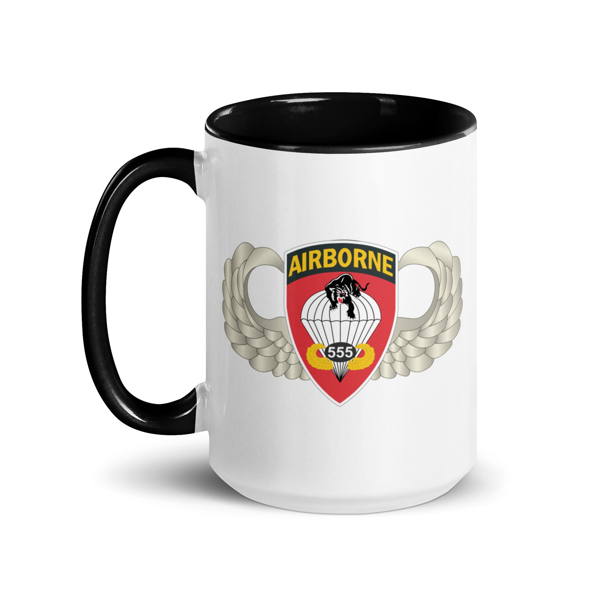  "Ceramic mug with black interior featuring 555th Parachute Infantry Battalion SSI, front view"