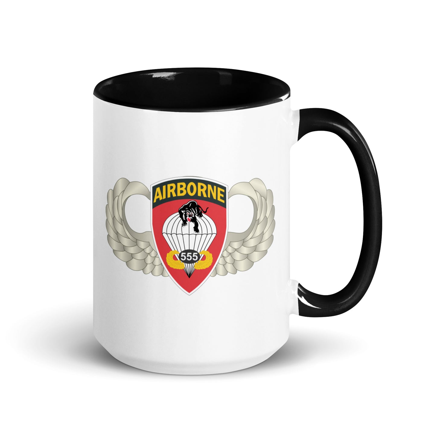 Product mockup "Ceramic mug with black interior featuring 555th Parachute Infantry Battalion SSI, rear view"