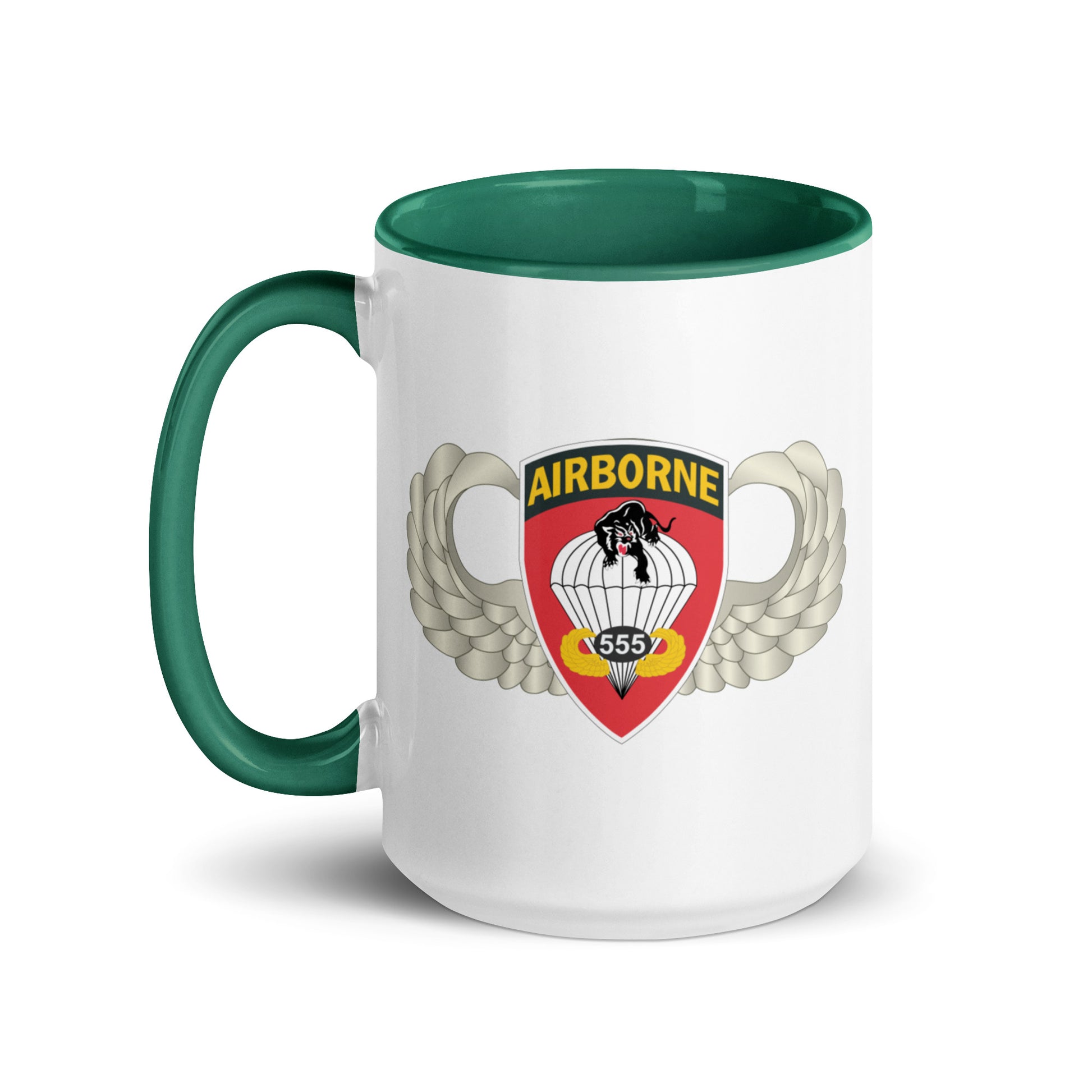  "Ceramic mug with dark green interior featuring 555th Parachute Infantry Battalion SSI, front view"