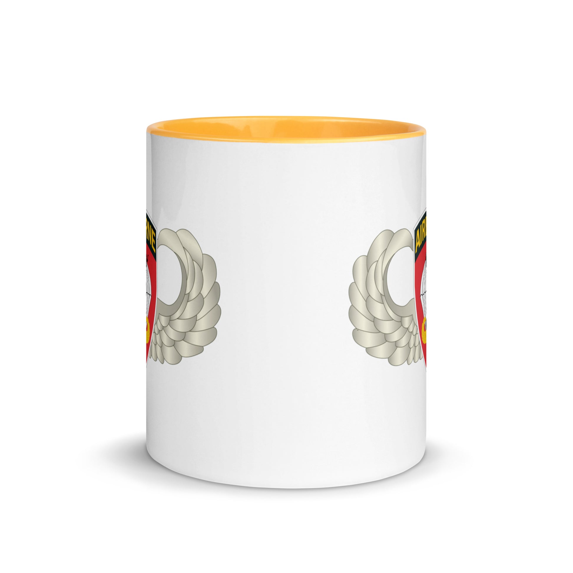  "Ceramic mug with golden yellow interior featuring 555th Parachute Infantry Battalion SSI, center view"