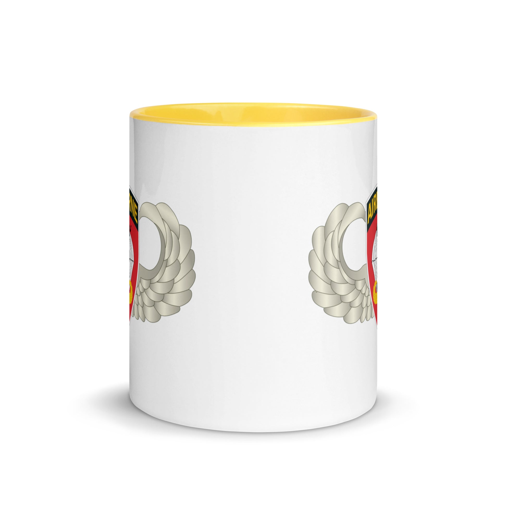  "Ceramic mug with yellow interior featuring 555th Parachute Infantry Battalion SSI, center view"